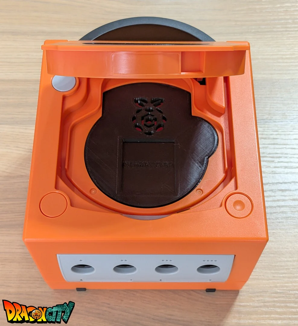 GameCube JAP 60Hz + Coque Orange (Neuve) + Picoboot + Cache lecteur 3D + Sandisk Swiss 512Go + SD2SP2 PRO V2